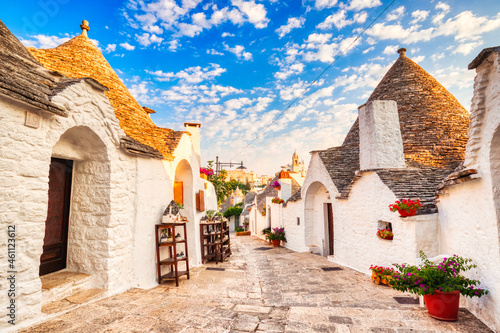 Famous Trulli Houses during a Sunny Day with Bright Blue Sky in Alberobello, Puglia photo