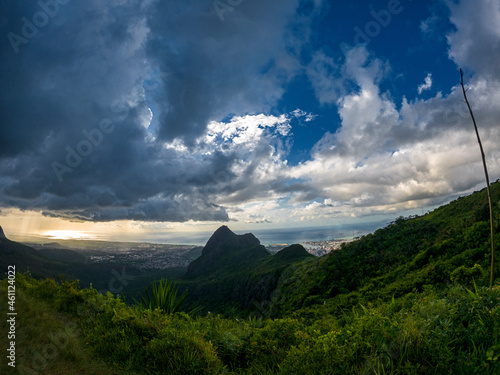 View of mountains and Port Louis  city from top of Le Pouce mountain located in Mauritius during a cloudy late afternoon