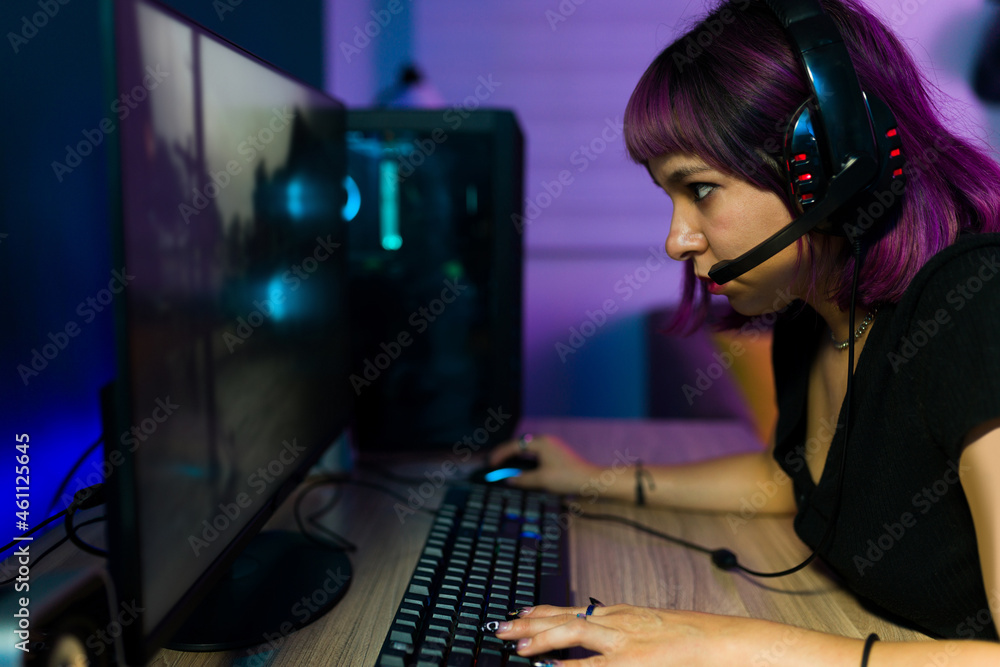Beautiful gamer with a lot of concentration Beautiful gamer with a lot of concentration