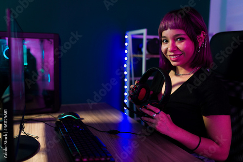 Portrait of a female gamer feeling happy © AntonioDiaz
