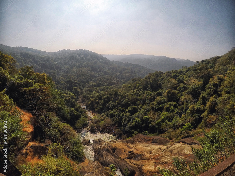 View of a valley and mountains from Dudhsagar waterfall bridge located in Kulem, Goa, India