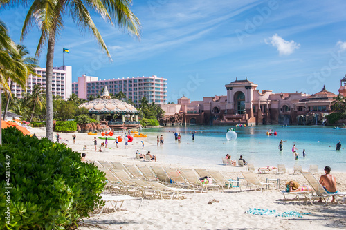 One of the private beaches in Atlantis Resort, Bahamas with beautiful blue sky and palm trees 