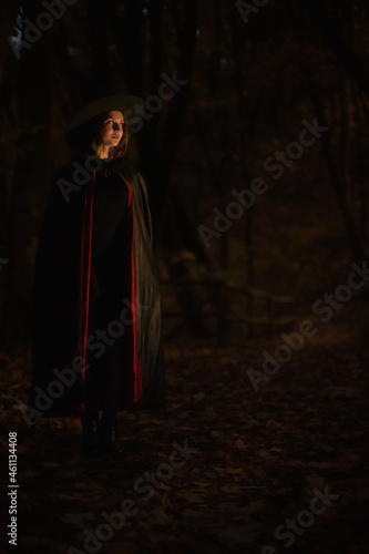 soft focus noise polluted teenager girl Halloween witch portrait vertical photography dark forest