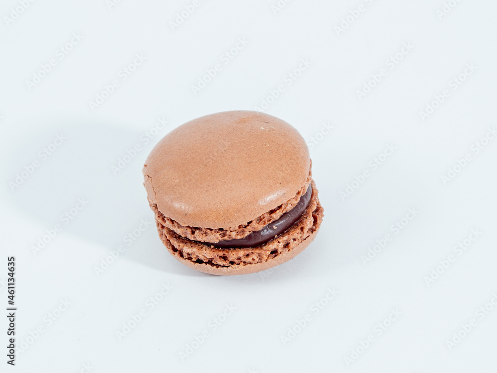 Sweet chocolate macarons isolated on white background. Sweet chocolate macarons isolated on white background.