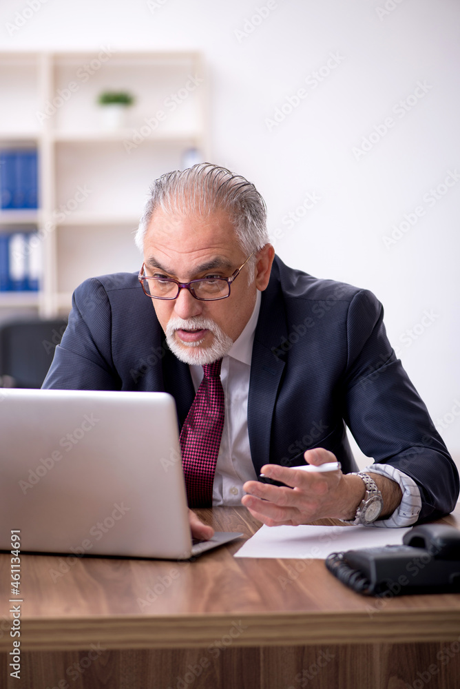 Old male employee and too much work in the office Old male employee and too much work in the office