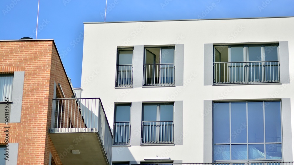 Modern apartment building. Modern urban architecture and details of building facade. Sunlight. Modern apartment building. Modern urban architecture and details of building facade. Sunlight.
