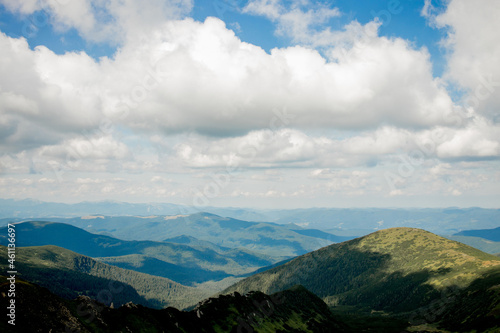 Incredibly beautiful panoramic views of the Carpathian Mountains. Peaks in the Carpathians on a background of blue sky