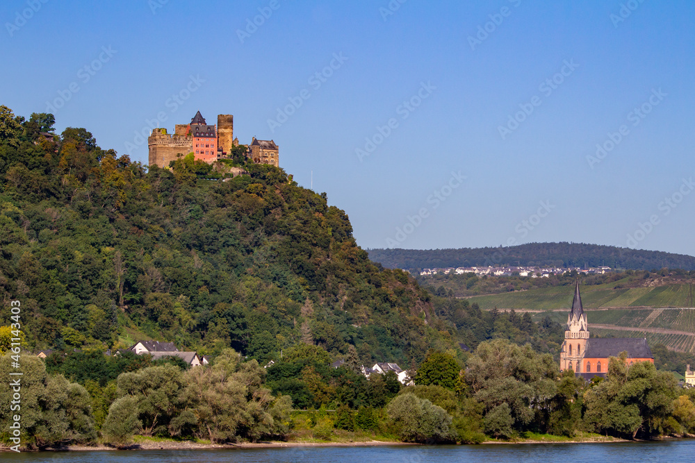 Schönburg Castle landscape on the upper middle Rhine River near Oberwesel, Germany. Also known as Burg Schönburg, with view of the Red Church (Liebfrauenkirche).