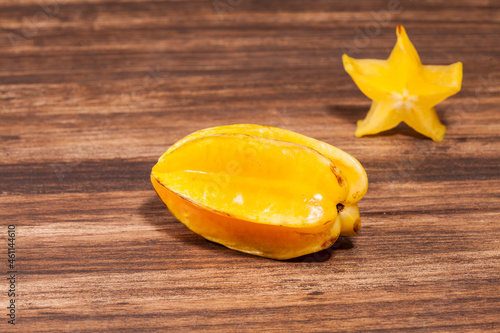 Averrhoa Carambolo - Star Fruit Or Carambola; Photo On Wooden Background photo