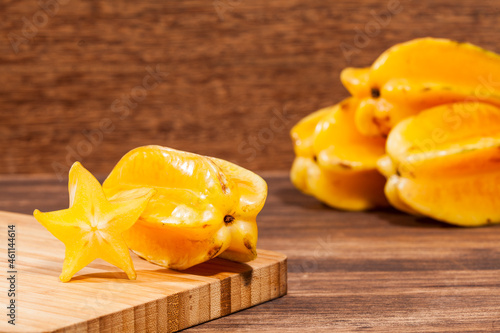 Averrhoa Carambolo - Star Fruit Or Carambola; Photo On Wooden Background photo