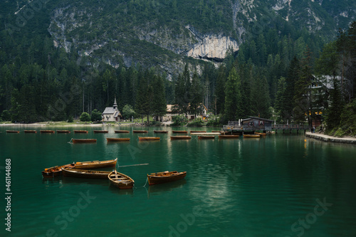 Lago di Braies (Braies lake, Pragser wildsee) wooden boats in Lake in South Tyrol, Italy   moody evening (high ISO photography) © valdisskudre