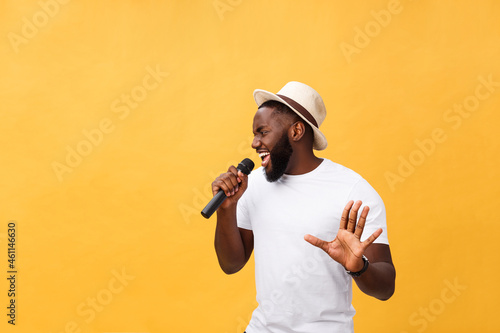 Young teenage black African American boy singer performing at a concert. photo