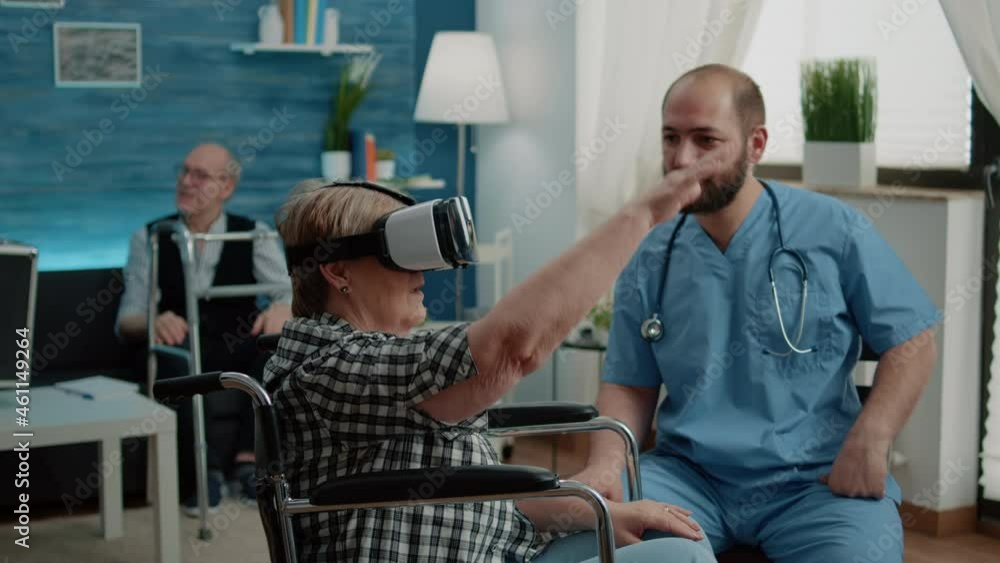 Disabled Old Woman In Wheelchair Using Vr Glasses In Nursing Home While Disabled old woman in wheelchair using vr glasses in nursing home while