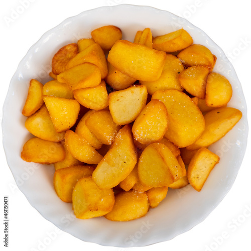 Delicious spanish patatas bravas tapas, fried pieces of potatoes. Isolated over white background