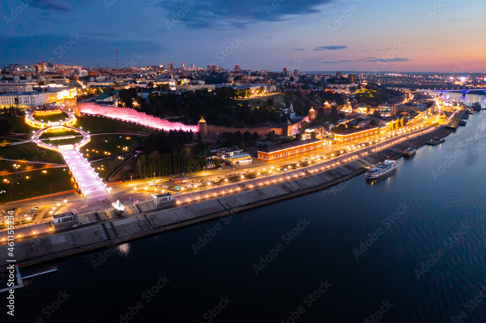 Bird's eye view of Nizhny Novgorod with turned on city lights in evening. Nizhniy Novgorod Kremlin visible from above.