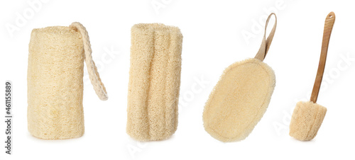 Set with natural shower loofah sponges and brush on white background. Banner design photo