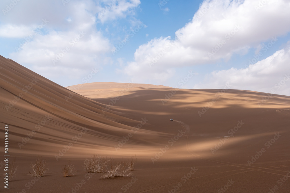Nature and landscapes of dasht e lut or sahara desert with sand dunes and cloudy evening sky