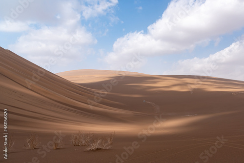 Nature and landscapes of dasht e lut or sahara desert with sand dunes and cloudy evening sky