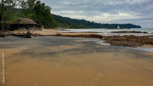 The sea, the waves, the rocks and the black beach.