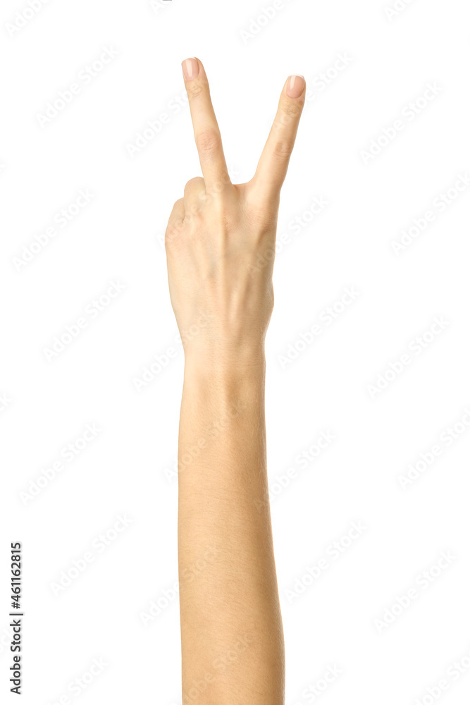 Victory sign. Woman hand gesturing isolated on white Victory sign. Woman hand gesturing isolated on white