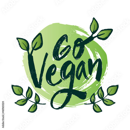 Go vegan hand lettering with green leaf.