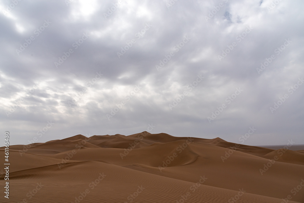 view from Nature and landscapes of dasht e lut or sahara desert after the rain with wet sand dunes and cloudy sky. Middle East desert view from Nature and landscapes of dasht e lut or sahara desert after the rain with wet sand dunes and cloudy sky. Middle East desert