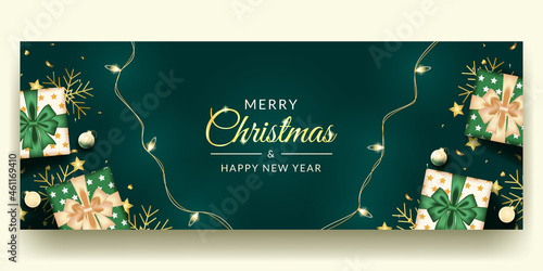 merry christmas and happy new banner design with realistic green decoration