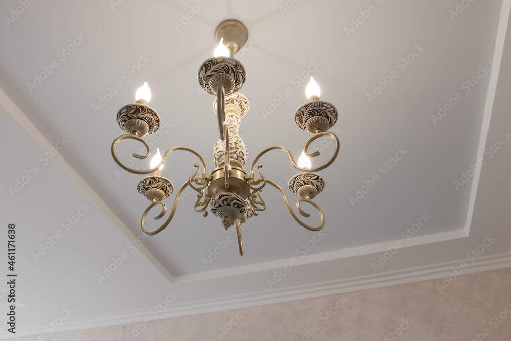 chandelier in a modern style with glowing bulbs contours and curves for a large house chandelier in a modern style with glowing bulbs contours and curves for a large house