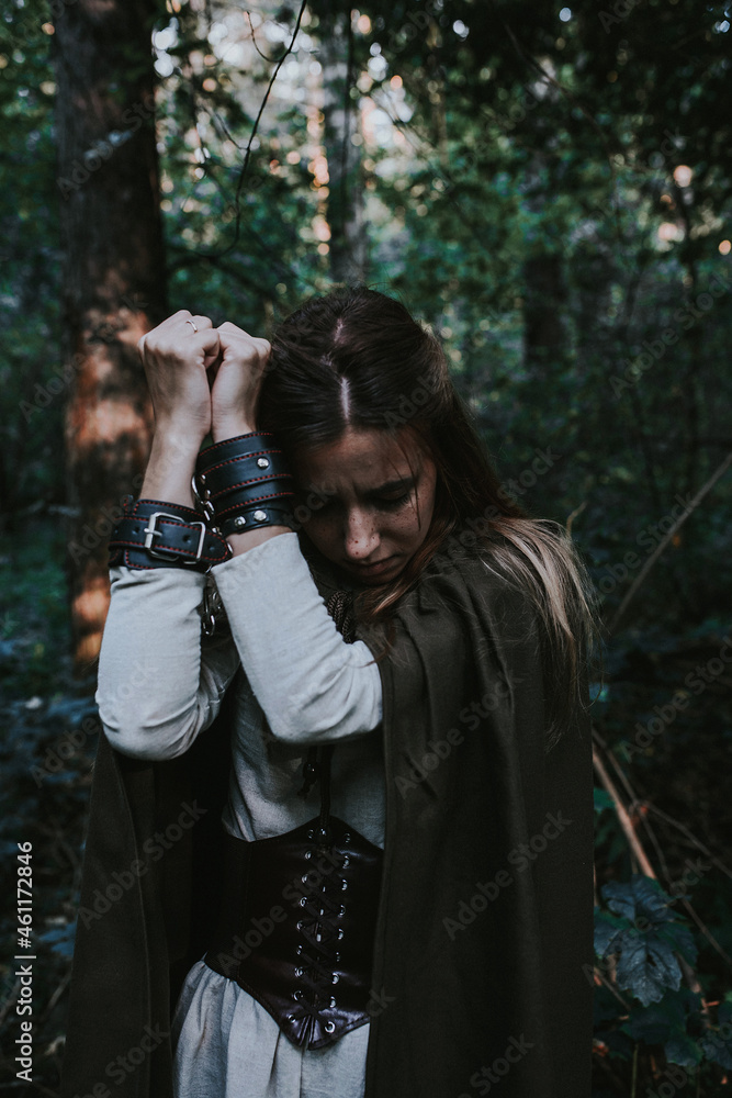 girl in a historical dress in a coniferous forest girl in a historical dress in a coniferous forest