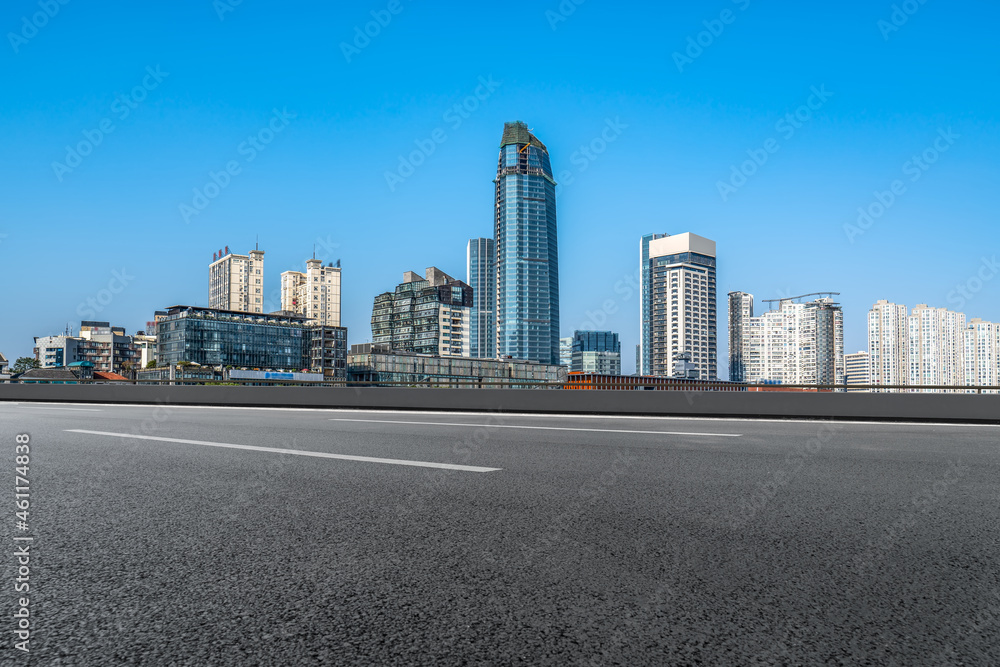 Empty asphalt road and city skyline and building landscape, China. Empty asphalt road and city skyline and building landscape, China.