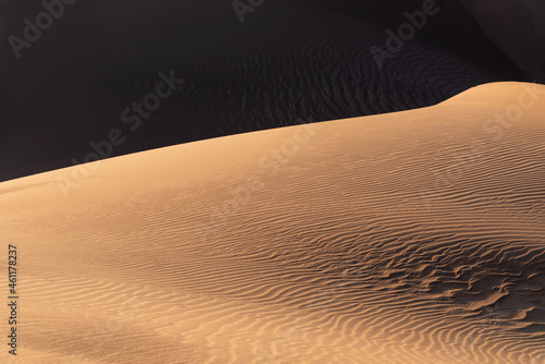 the formation of sands in dasht e lut or sahara desert with waved sand pattern on sand dune. Nature and landscapes of desert. Middle East desert