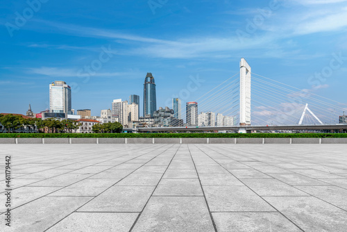 empty brick floor with city skyline background © 昊 周
