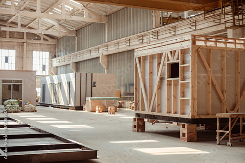 Building under construction with prefabricated containers and cabins photo
