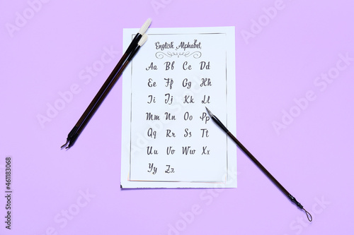 Paper with alphabet and bru...