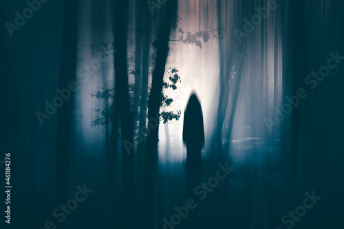 Fototapeta Naklejka Na Ścianę i Meble -  Horror halloween concept. strange silhouette in a dark spooky forest at night