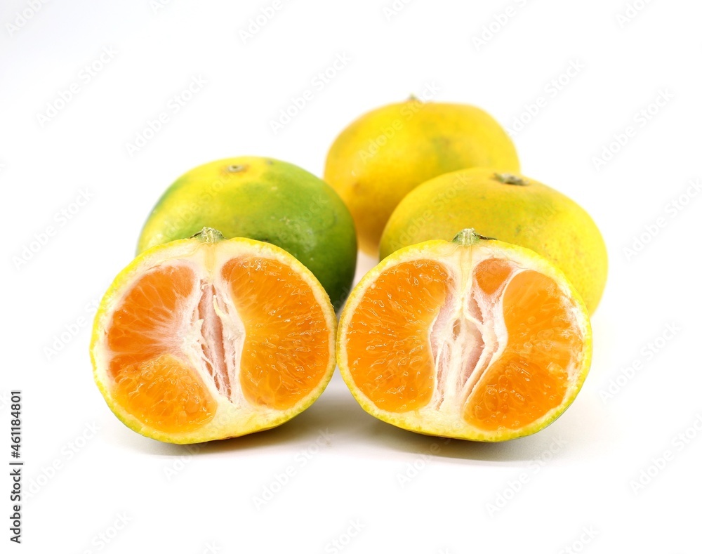 Sicilian green mandarin on white background. In addition to being eat as fruit, its peel is used for the production of aromas and fragrances Sicilian green mandarin on white background. In addition to being eat as fruit, its peel is used for the production of aromas and fragrances