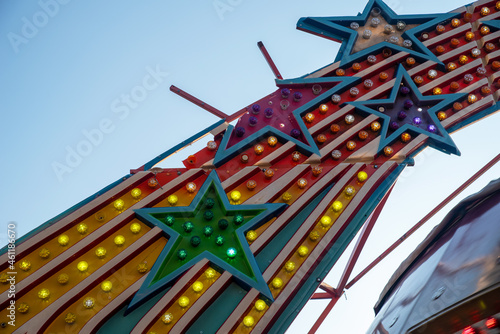 broken stars on old amusement park ride lights colorful bulbs