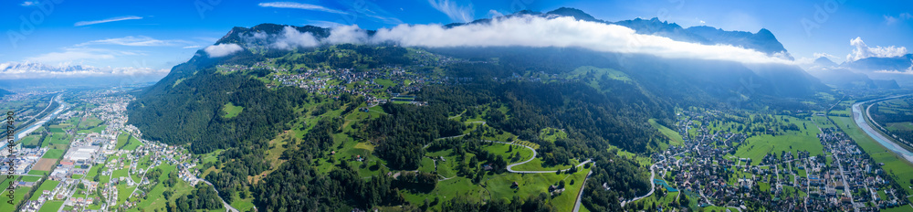 Aerial view of the city Triesen in Liechtenstein at the swiss border on a sunny day in summer.	