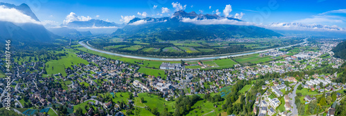 Aerial view of the city Triesen in Liechtenstein at the swim border on a sunny day in summer.	 photo