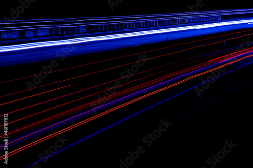 Night road lights. Lights of moving cars at night. long exposure red, blue, green © Remigiusz