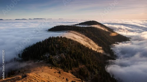 Time lapse, Above clouds in fall - mountain landcape at sunset, Slovakia photo