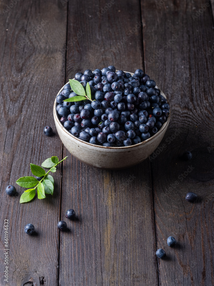 Blueberry bowl on wooden background with copy space in rustic style Blueberry bowl on wooden background with copy space in rustic style