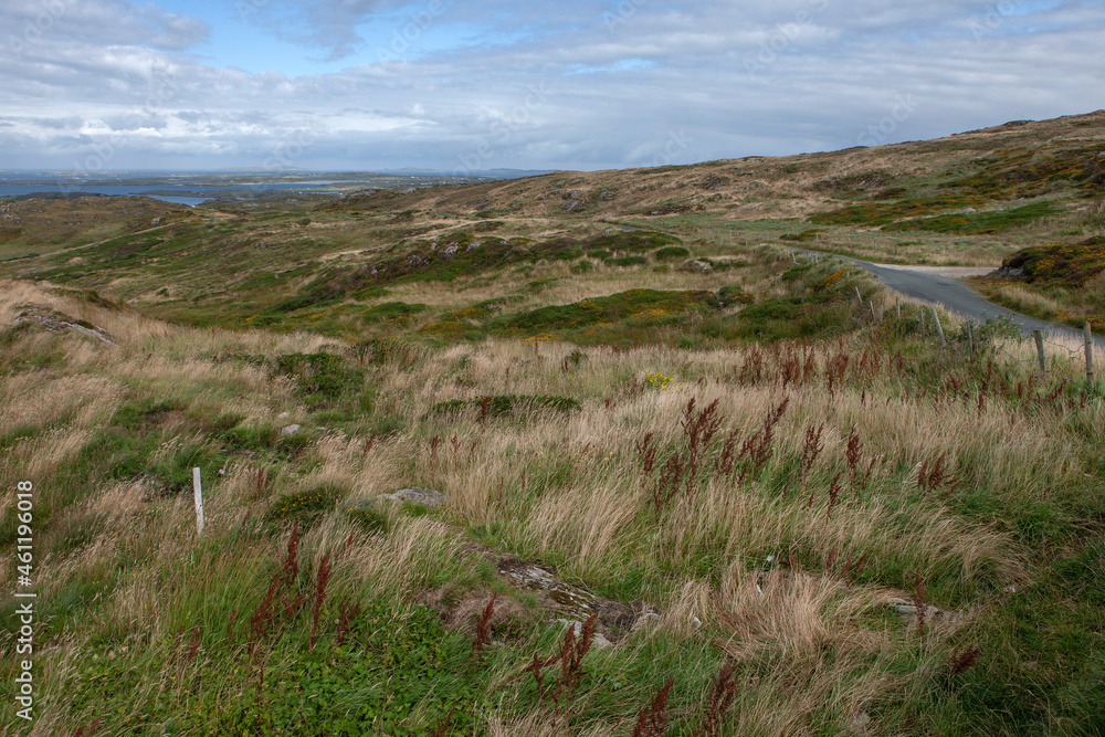 Hills and dunes. Road at the coast. Ocean. Ireland Connemara Westcoast. 