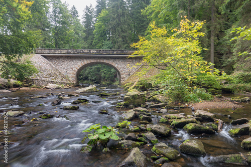 Bridge gate Zemska brana, river Divoka Orlice, Czech republic Eagle mountains (Orlicke hory) during summer time.