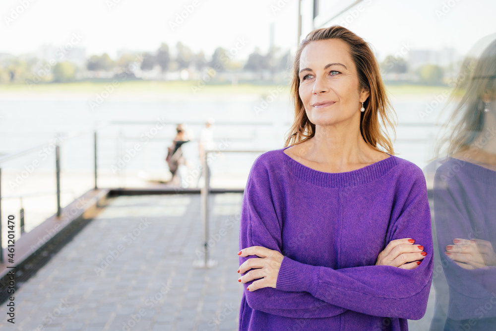 Calm thoughtful middle-aged woman with faraway expression Calm thoughtful middle-aged woman with faraway expression