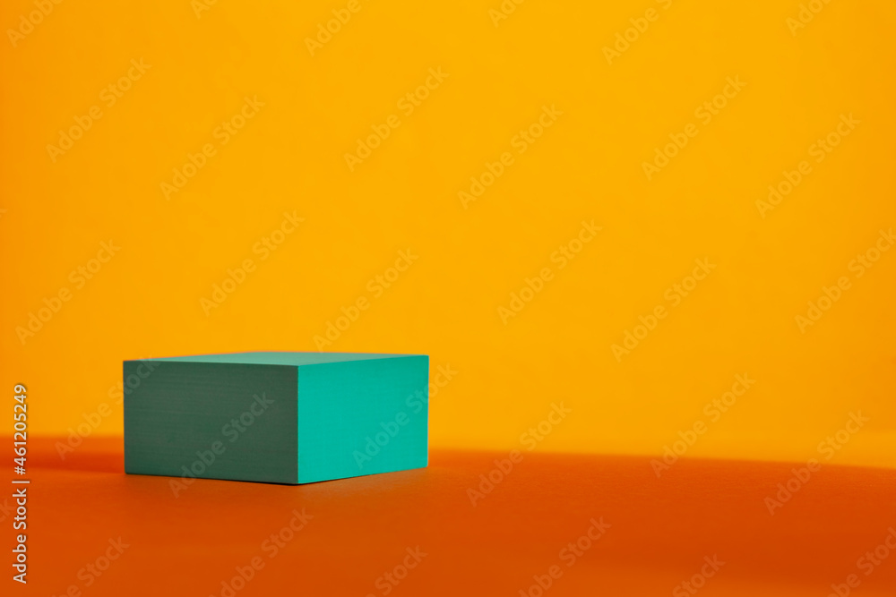 Turquoise podium with shadows leaves on orange background. Concept scene stage showcase for product, promotion, sale. Turquoise podium with shadows leaves on orange background. Concept scene stage showcase for product, promotion, sale.