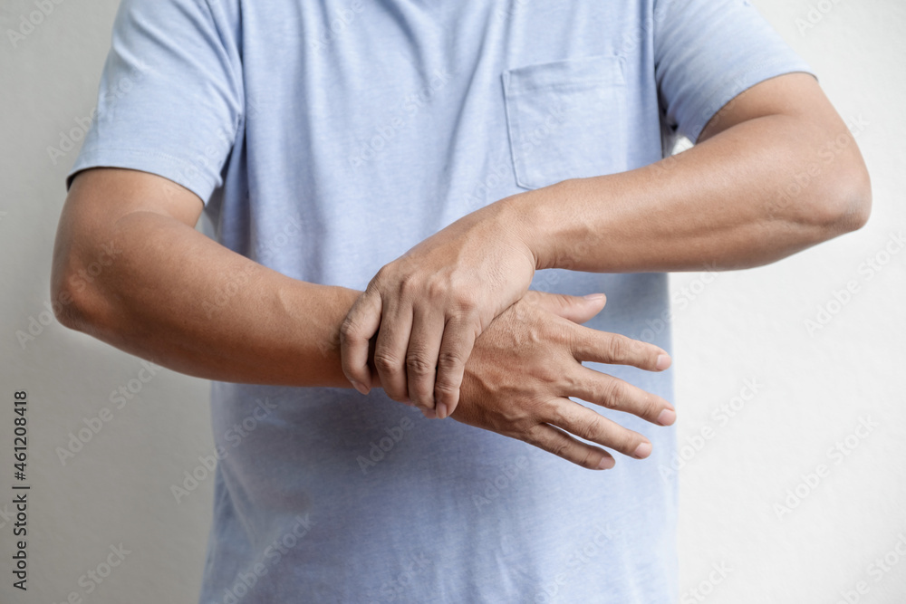 Man hand massage physiotherapy wrist is sore and numb, exhausted, tingling. Guillain-Barre Syndrome, a side effect of the Covid vaccination Man hand massage physiotherapy wrist is sore and numb, exhausted, tingling. Guillain-Barre Syndrome, a side effect of the Covid vaccination