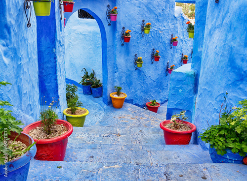 Chefchaouen Morocco. Typical bright blue staircase in the medina, decorated with colourful flowerpots. © Anette Andersen