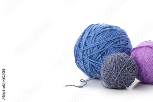 Multi colored balls of yarn, isolated on white background