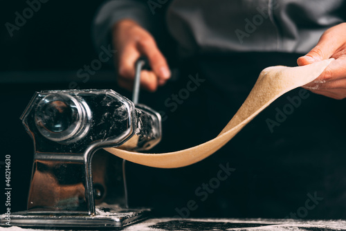 Fototapeta Naklejka Na Ścianę i Meble -  Close up photo of the pasta making machine in process.